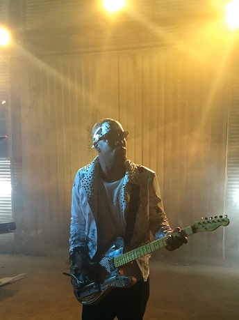 Wyclef Jean plays Tony Cochran guitar SYX at video shoot Picture